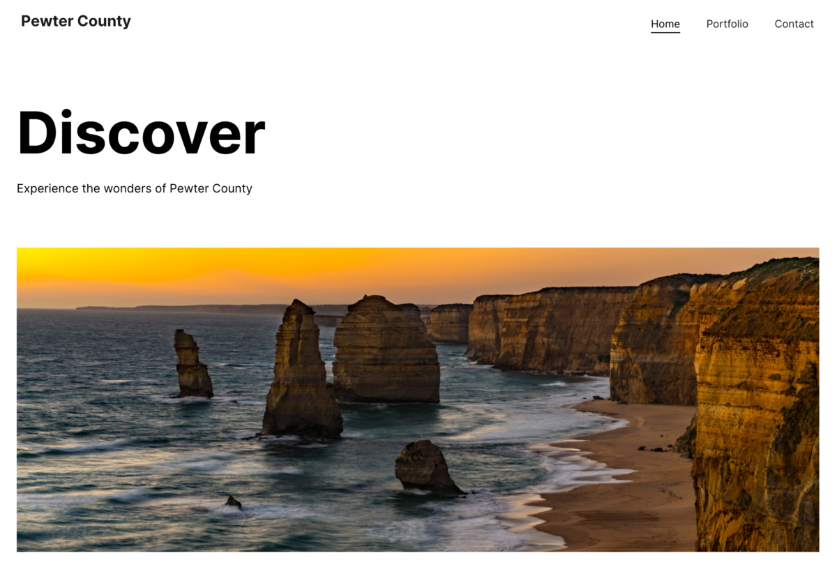 Site layout for an other type park services site with navigation, followed by a heading reading discover, subtext, and a picture of cliffs and the ocean.